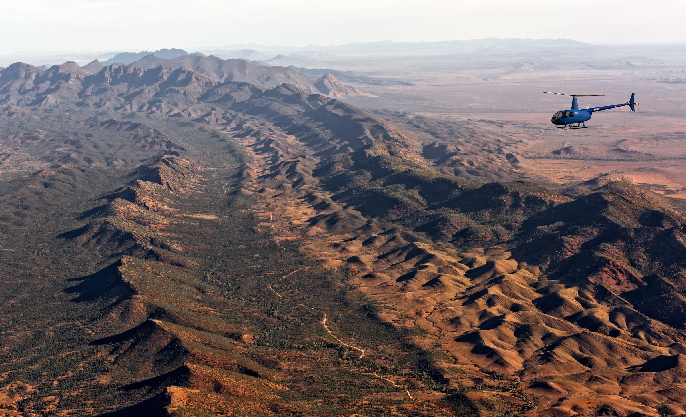 Helicopter flying above Arkaba in the Flinders Ranges