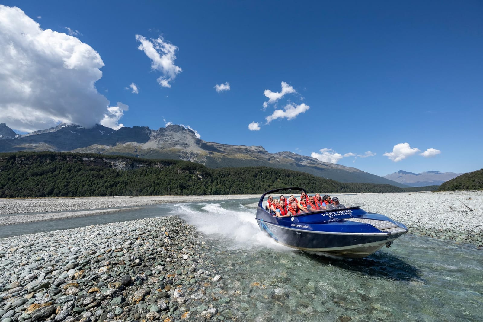 Jetboat crossing the braided Dart River near Glenorchy