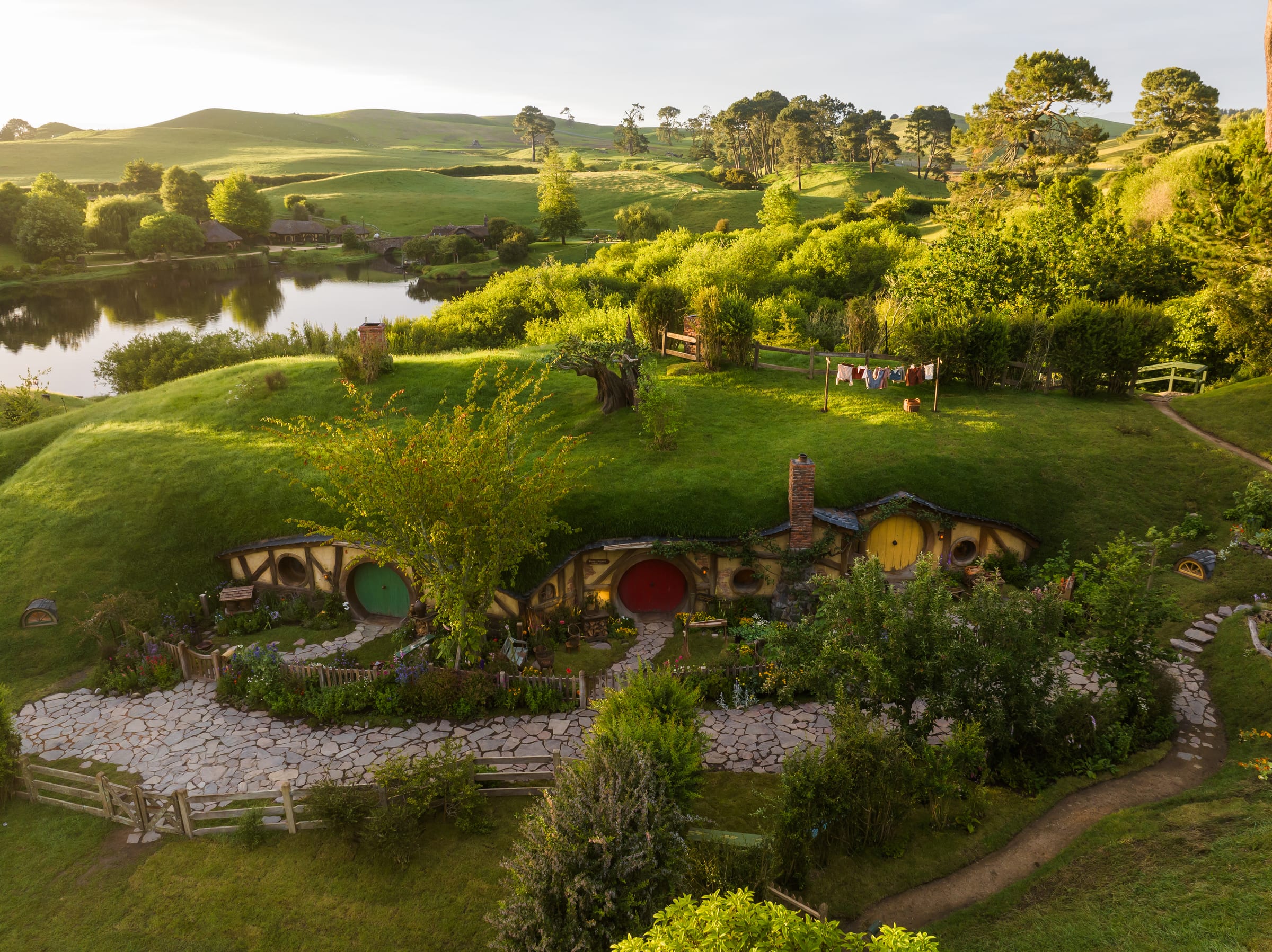 Hobbit holes across the hillside at Hobbiton Movie Set in Matamata